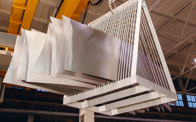 Pickled titanium sheets on a lifting rack for evidence and packing review