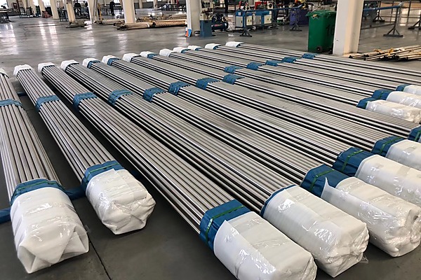 Grade 2 titanium tube and plate for corrosion resistant heat transfer service