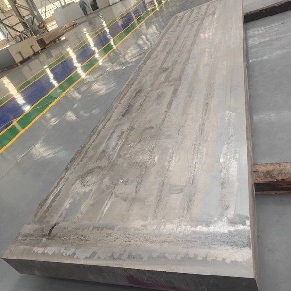 Forged titanium slab prepared for forming and downstream processing