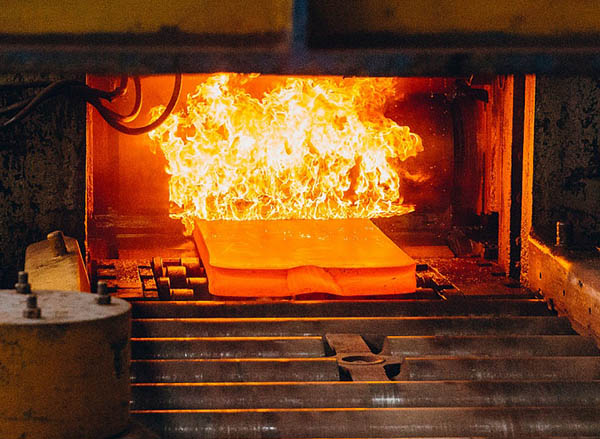 In-house titanium alloy heat treatment furnace and plate loading